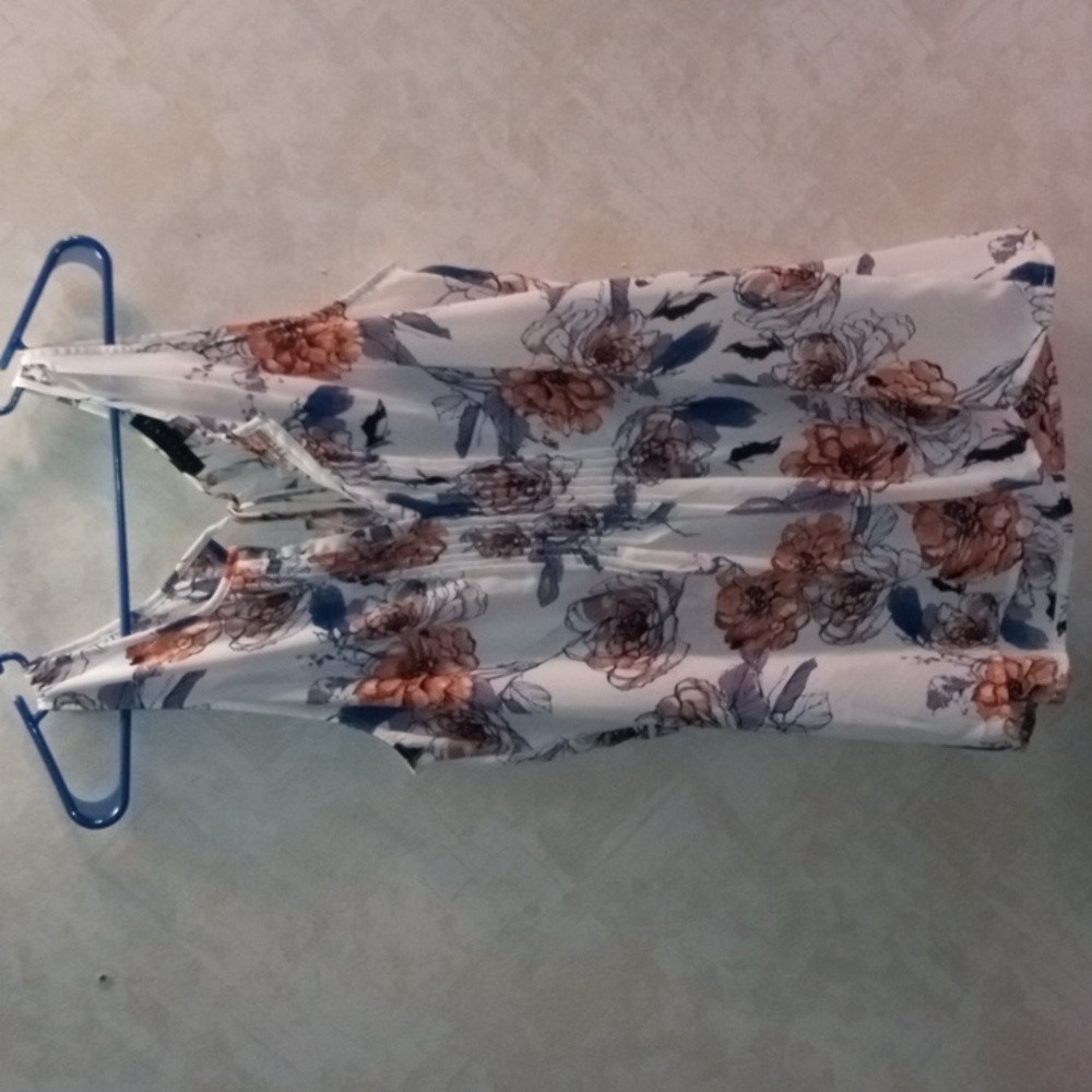 Floral sleeveless blouse. It's an extra large and it's by sanctuary.